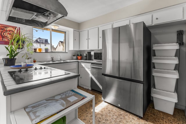 kitchen featuring range hood, a sink, light countertops, white cabinets, and appliances with stainless steel finishes