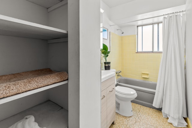 full bathroom featuring vanity, tile patterned floors, shower / tub combo, and toilet