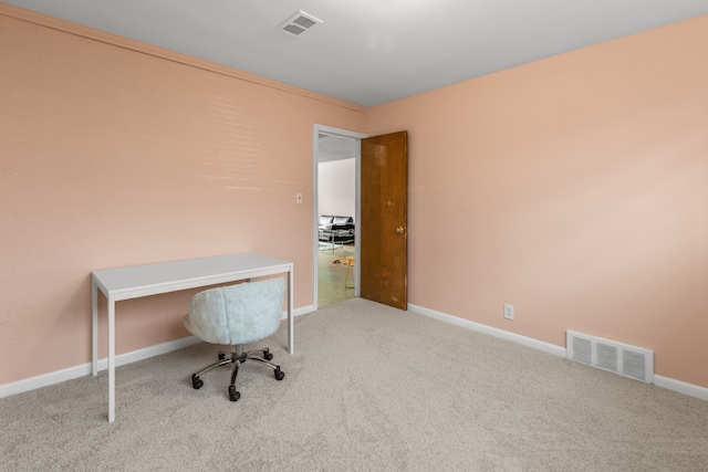 home office with carpet flooring, baseboards, and visible vents