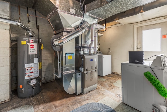 utilities featuring heating unit, gas water heater, and separate washer and dryer