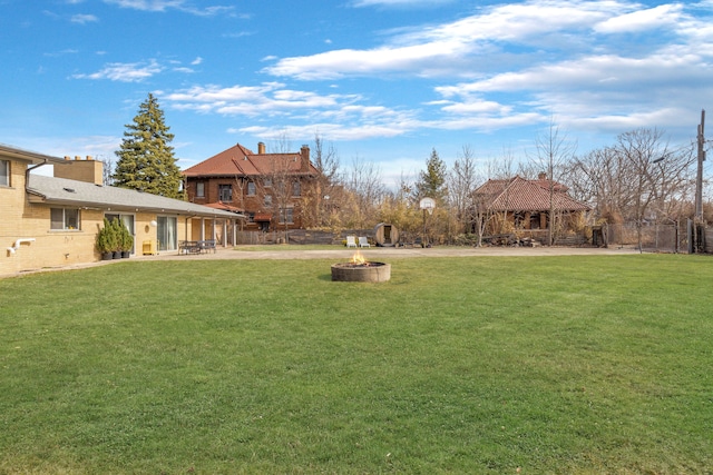 view of yard featuring a patio area and an outdoor fire pit