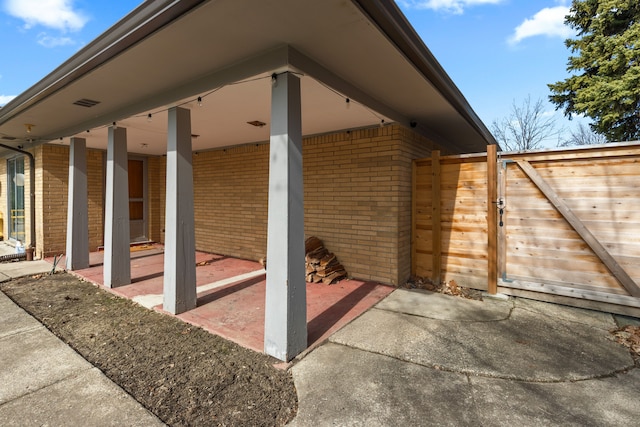 view of patio / terrace with fence and a gate