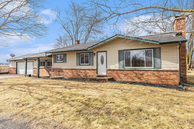 single story home with brick siding, an attached garage, a chimney, and a front lawn