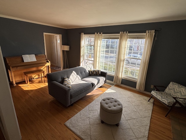 living room featuring wood finished floors and ornamental molding