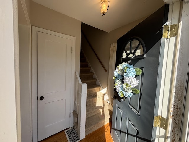 entrance foyer with visible vents and stairs