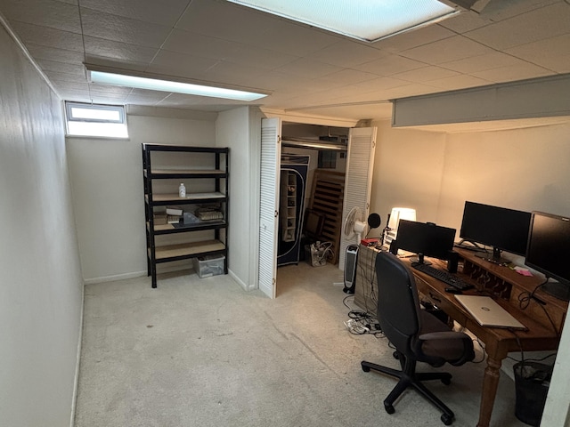 home office featuring carpet flooring and baseboards