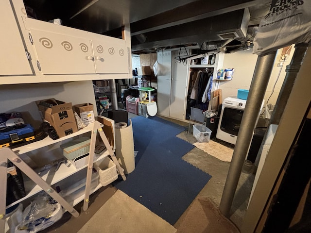 unfinished basement with washer / clothes dryer