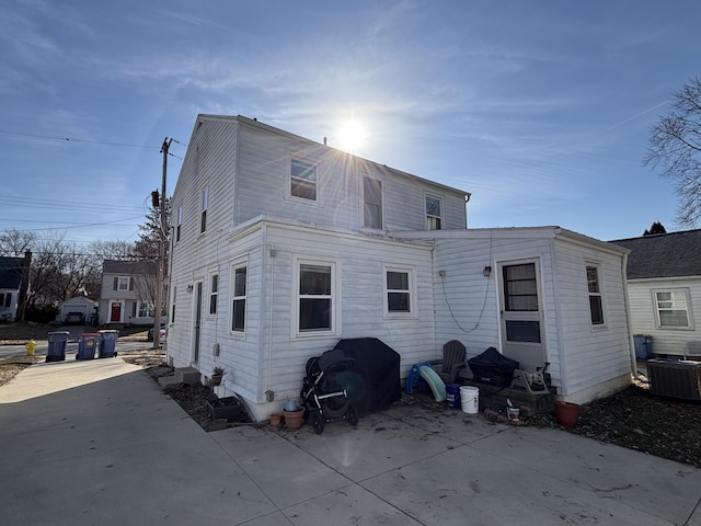 back of property with central air condition unit