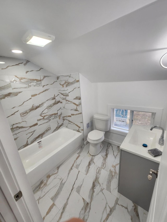 full bathroom with toilet, lofted ceiling, bathtub / shower combination, marble finish floor, and vanity