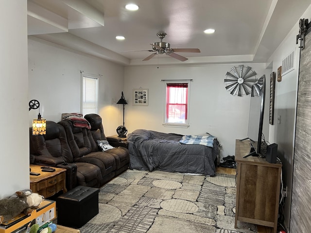 bedroom with visible vents, recessed lighting, a raised ceiling, and a ceiling fan