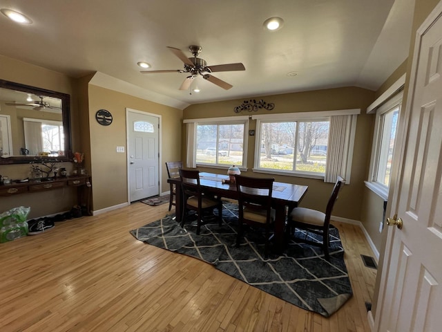 dining room with visible vents, lofted ceiling, and a ceiling fan