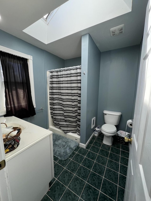 full bathroom with visible vents, curtained shower, toilet, a skylight, and tile patterned floors