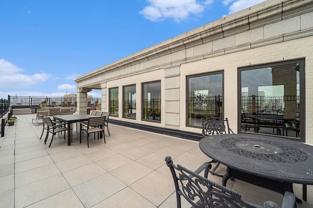 view of patio / terrace with outdoor dining area and fence