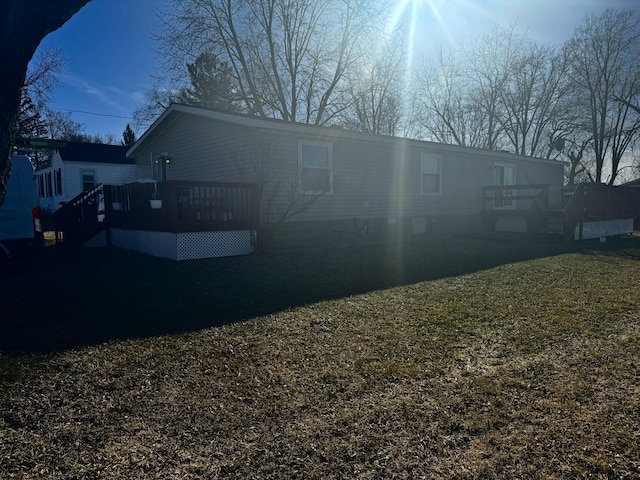 rear view of property with a deck