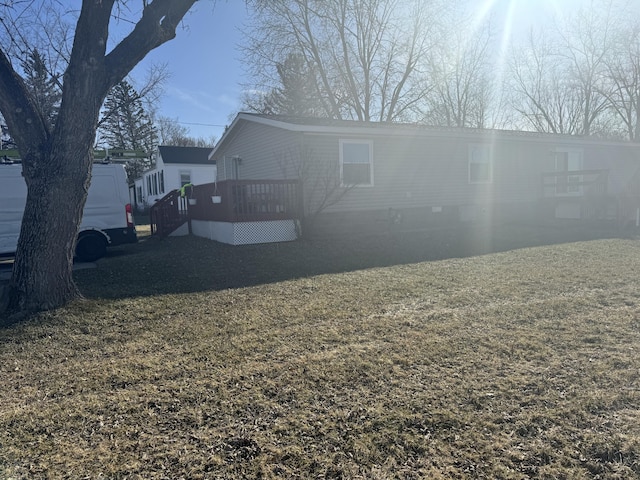 view of side of home featuring crawl space and a deck