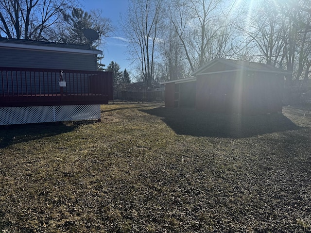 view of yard with fence and a wooden deck