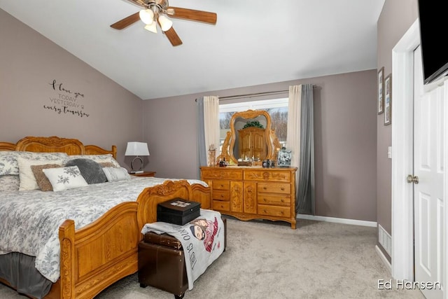 bedroom with baseboards, light carpet, lofted ceiling, and ceiling fan