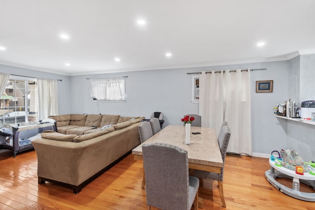 dining room featuring recessed lighting, baseboards, light wood finished floors, and ornamental molding