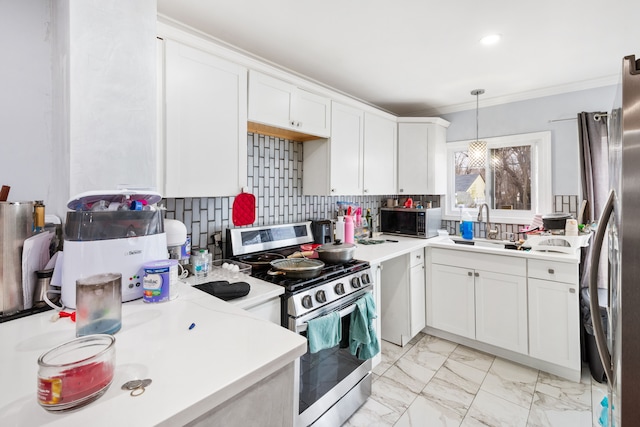 kitchen with tasteful backsplash, stainless steel appliances, marble finish floor, white cabinetry, and a sink