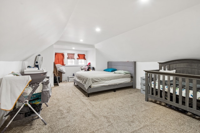 carpeted bedroom featuring recessed lighting and lofted ceiling