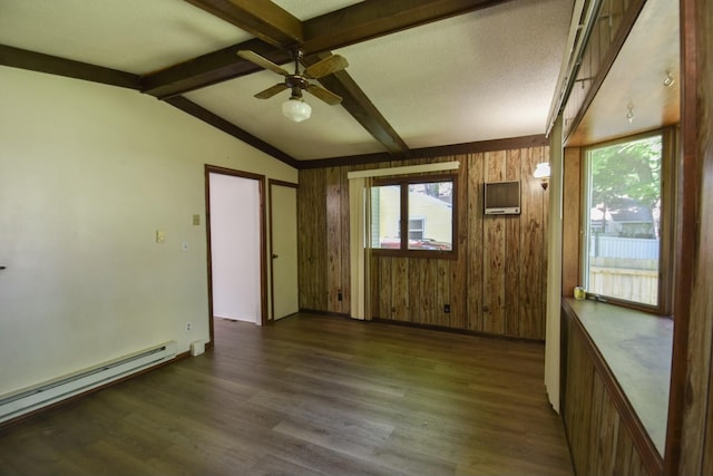 unfurnished room featuring dark wood finished floors, vaulted ceiling with beams, a healthy amount of sunlight, and a baseboard radiator