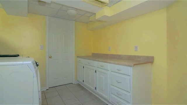 laundry area with light tile patterned flooring, laundry area, and washer and dryer