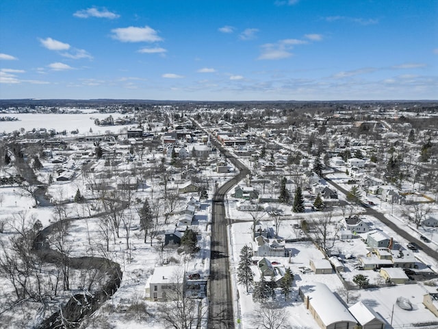 snowy aerial view featuring a residential view