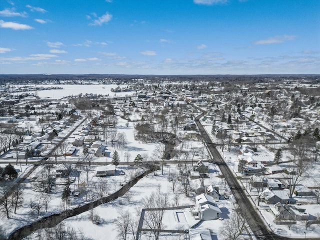 snowy aerial view featuring a residential view