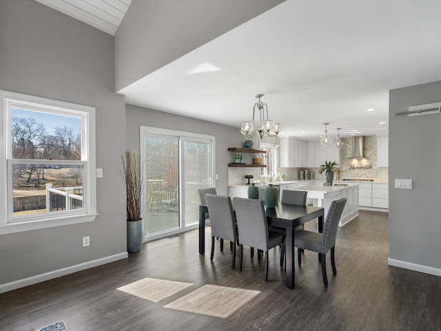 dining room featuring baseboards, dark wood-type flooring, and an inviting chandelier