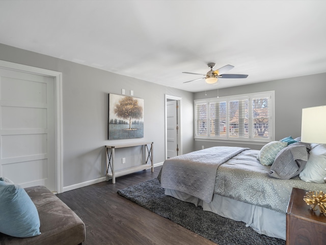 bedroom featuring wood finished floors, baseboards, and ceiling fan