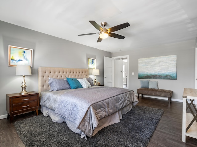 bedroom with ceiling fan, baseboards, and wood finished floors