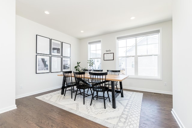 dining area featuring dark wood finished floors, recessed lighting, and baseboards