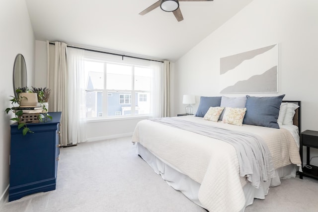 bedroom featuring baseboards, lofted ceiling, carpet, and ceiling fan