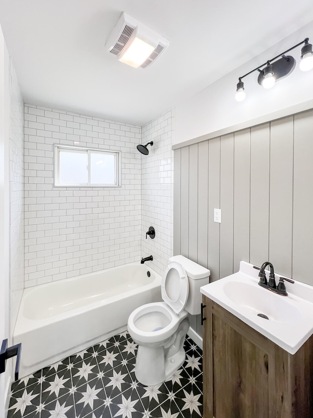 full bath with visible vents, toilet, shower / bathtub combination, tile patterned floors, and vanity