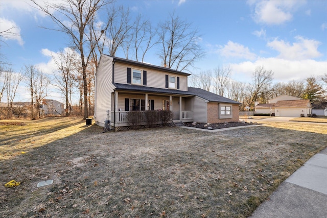 view of front of property with a porch and a front lawn