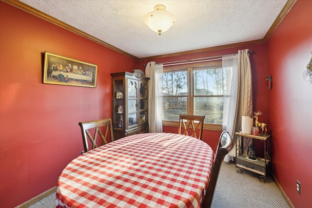 dining room with carpet floors, a textured ceiling, and crown molding