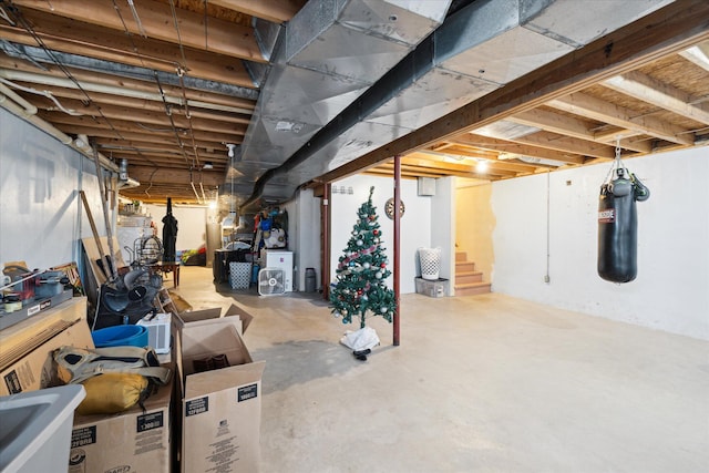 unfinished basement featuring stairs