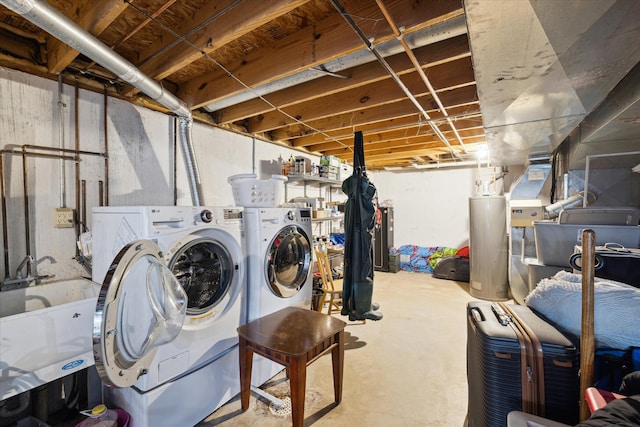 unfinished basement with gas water heater, washing machine and dryer, and a sink