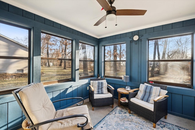 sunroom featuring ceiling fan