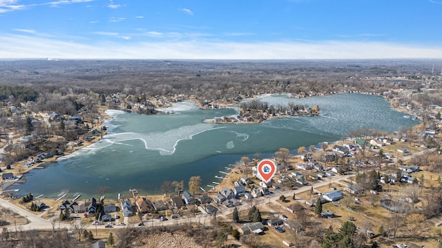 drone / aerial view with a residential view and a water view