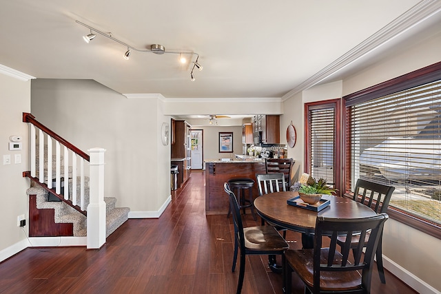 dining room featuring dark wood finished floors, stairs, baseboards, and ornamental molding