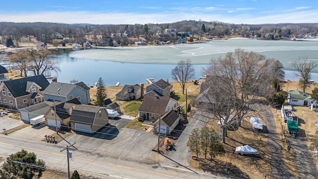 birds eye view of property with a water view and a residential view