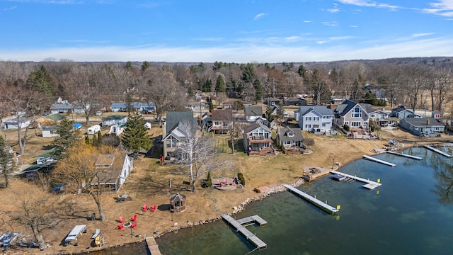 birds eye view of property with a residential view and a water view