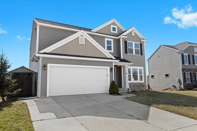 traditional home with concrete driveway, an outdoor structure, a storage unit, a front lawn, and board and batten siding