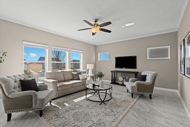 living area with marble finish floor, a ceiling fan, baseboards, and ornamental molding