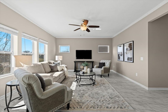 living room with plenty of natural light, ornamental molding, and a ceiling fan