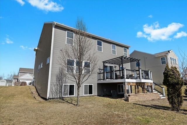 rear view of house featuring a lawn, a pergola, cooling unit, a wooden deck, and stairs