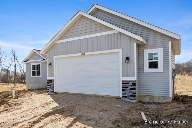 view of front of house with board and batten siding and a garage