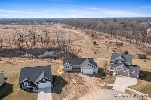 birds eye view of property with a rural view