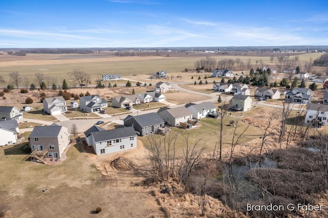 birds eye view of property featuring a rural view and a residential view